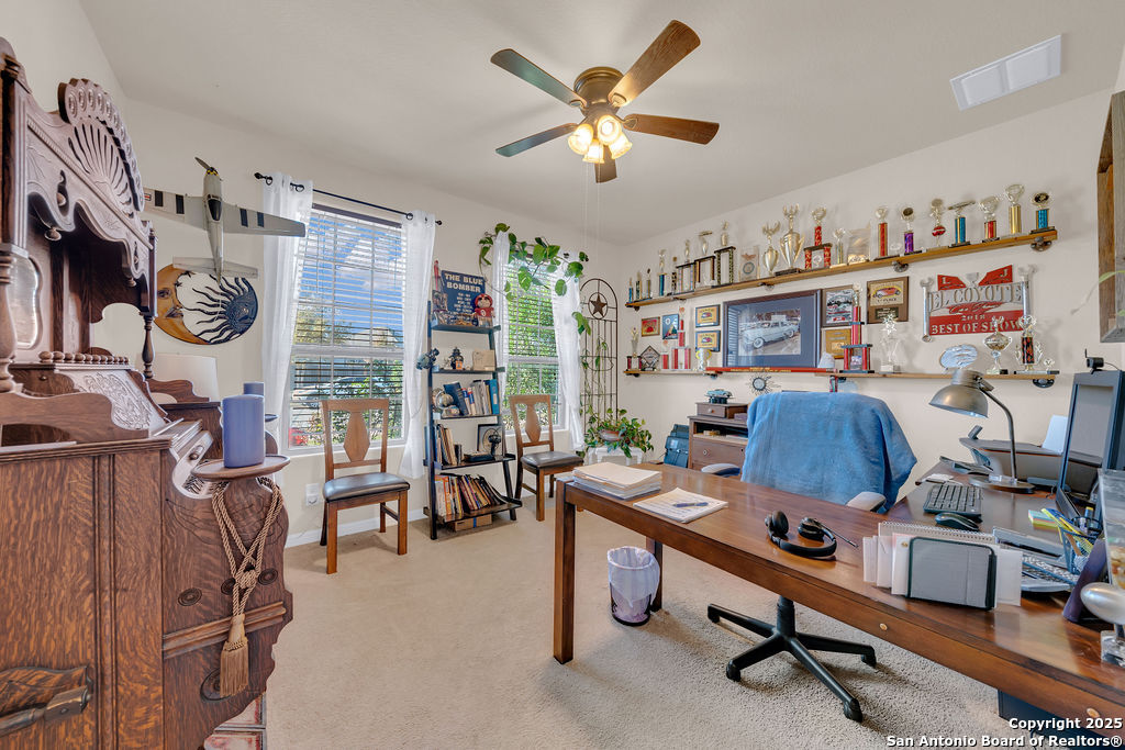 10222 Shawnee Converse, TX 78109 - Photo 4 of 28 a view of a workspace with furniture and a window