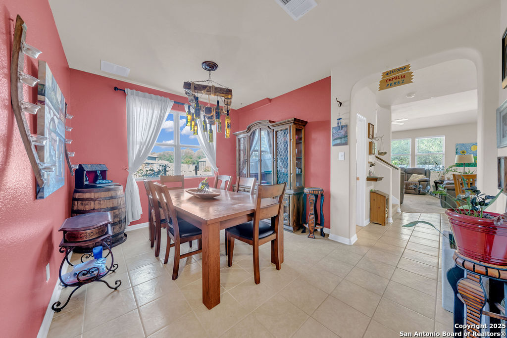 10222 Shawnee Converse, TX 78109 - Photo 5 of 28 a view of a dining room with furniture and a chandelier