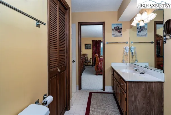 a en suite bathroom with a sink a toilet and mirror