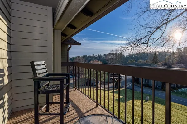 a view of a balcony with furniture