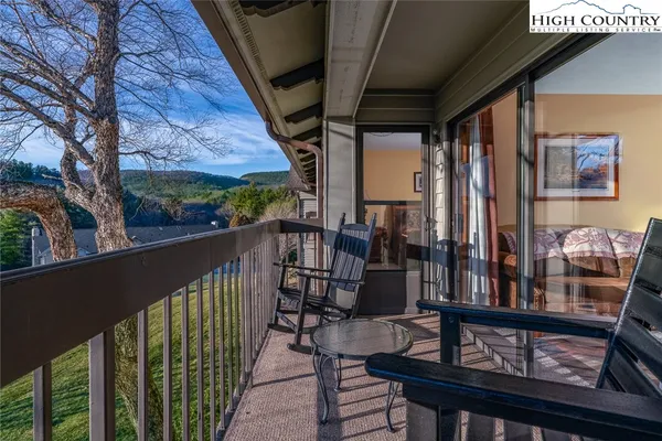 a view of balcony with furniture