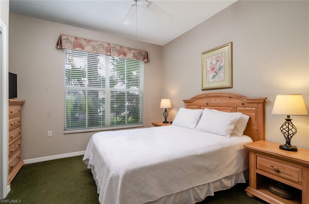 7920 Mahogany Run Lane, Unit 1011 Naples, FL 34113 - Photo 7 of 22 a bedroom with bed and a window