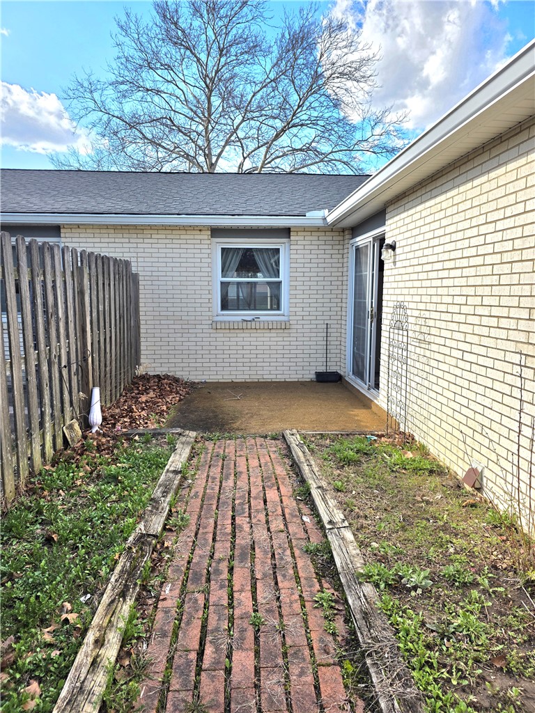 9920 Sheehan Road Dayton, OH 45458 - Photo 45 of 46 The outdoor area features a charming brick pathway leading to the home's exterior.