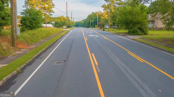 a picture of a glass window with a white house