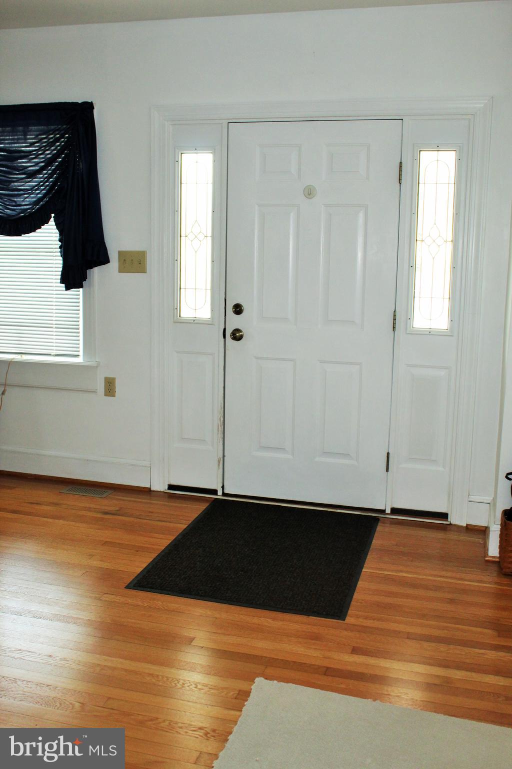 109 East 2nd Avenue Ranson, WV 25438 - Photo 3 of 31 14 x 12 foyer with hardwood flooring