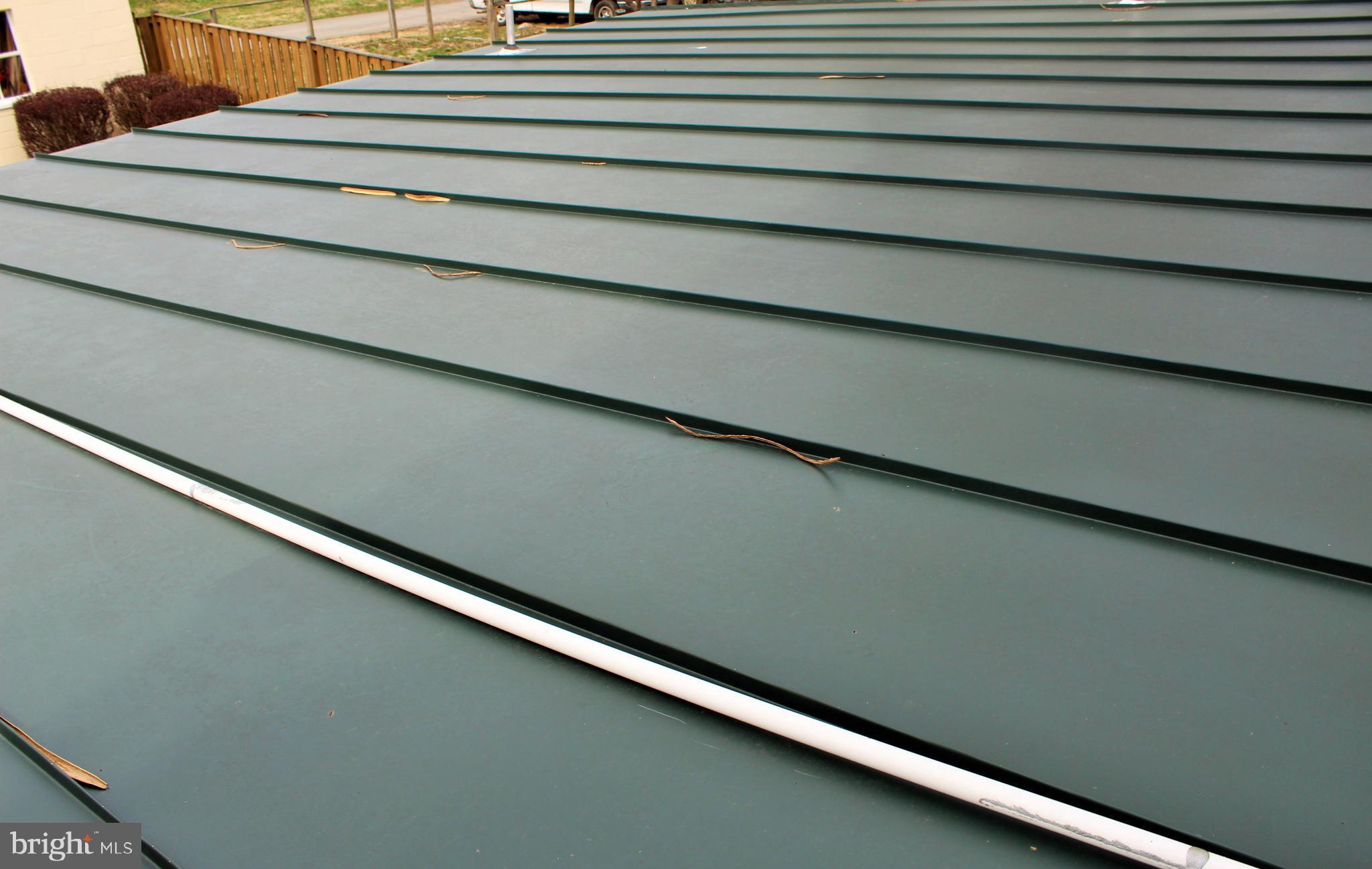 109 East 2nd Avenue Ranson, WV 25438 - Photo 28 of 31 Metal roof on kitchen addition
