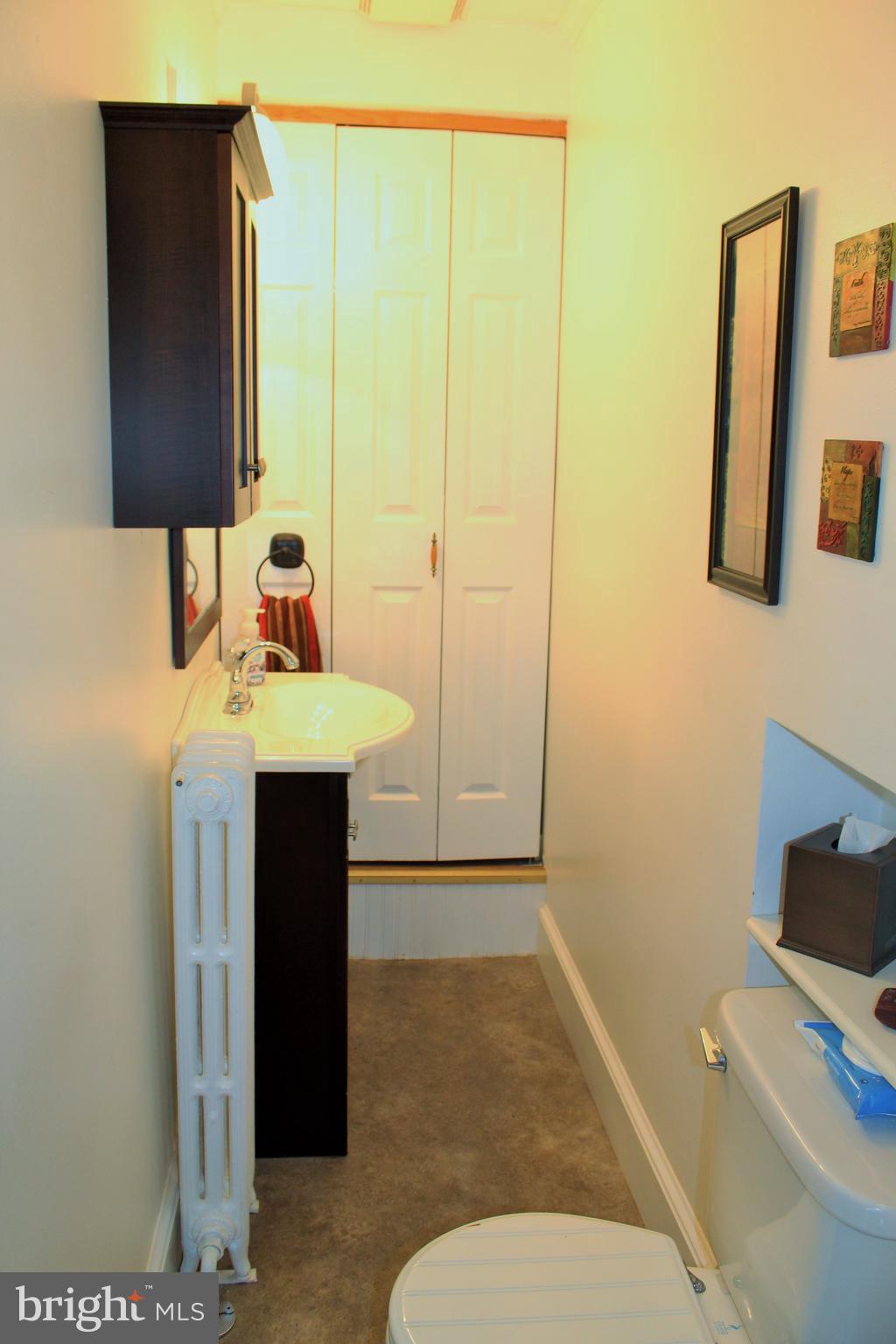 109 East 2nd Avenue Ranson, WV 25438 - Photo 6 of 31 Main level half bath has a large linen closet