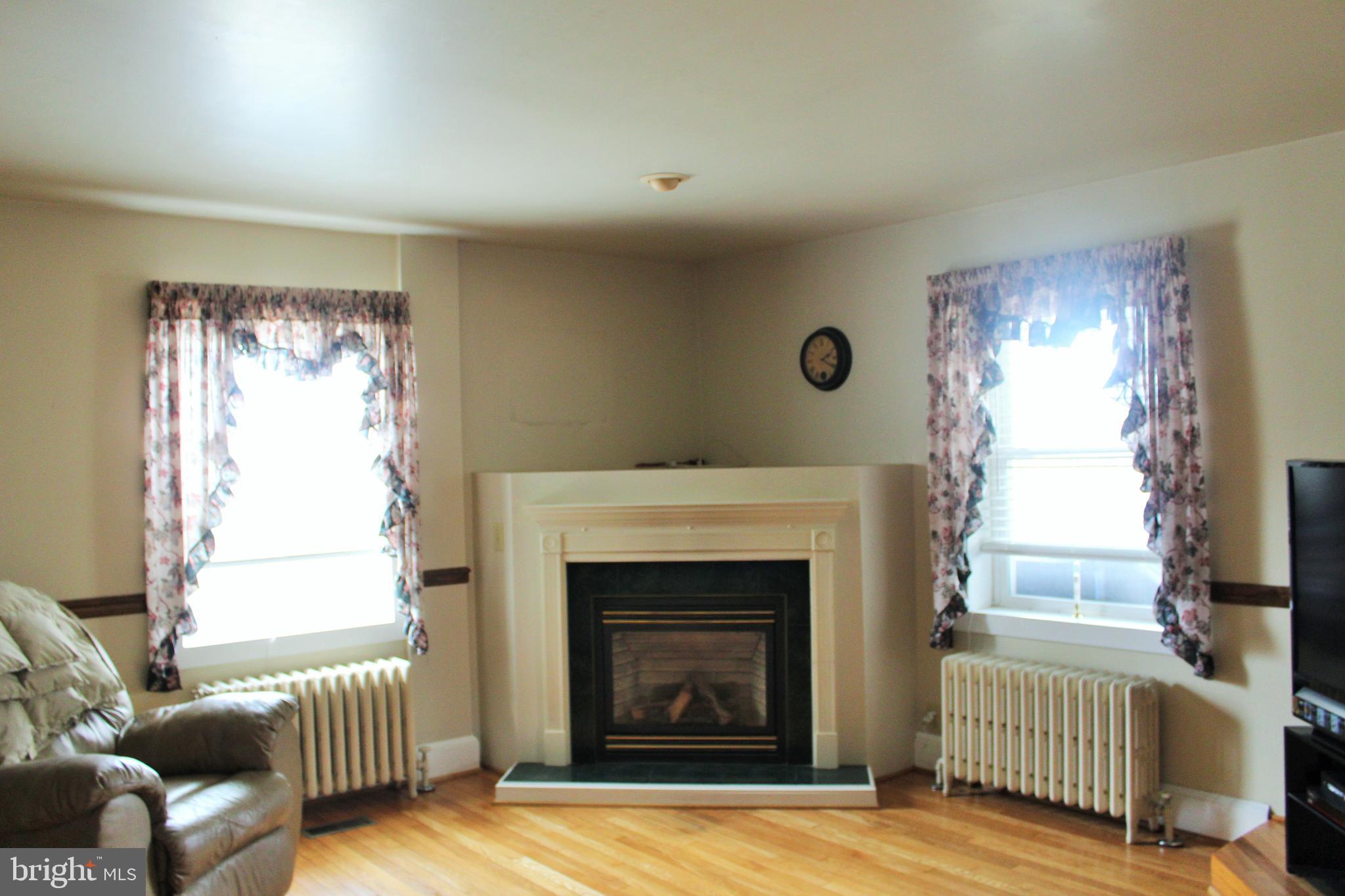 109 East 2nd Avenue Ranson, WV 25438 - Photo 8 of 31 Living room also has a propane fireplace