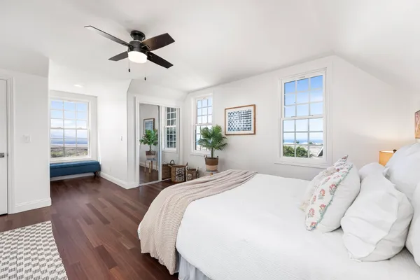 a bed room with a bed and a window