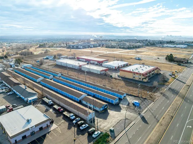 an aerial view of a city with parking