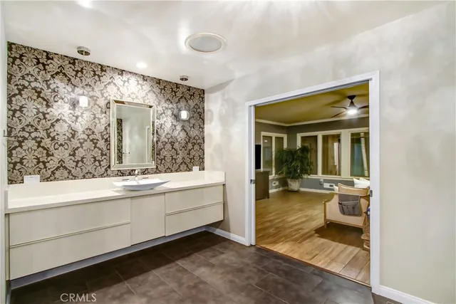 a bathroom with a sink and a mirror