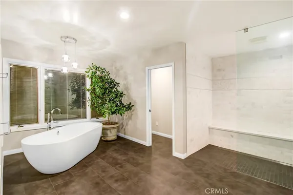 a view of a room with wooden floor and furniture