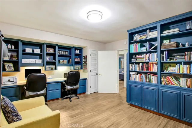 a living room with furniture and large window