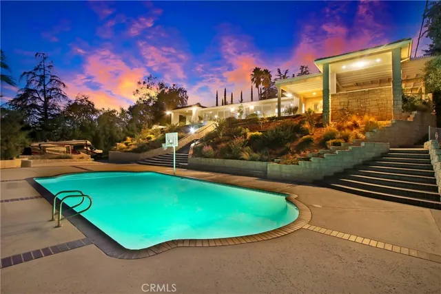 a building outdoor space with patio furniture and potted plants