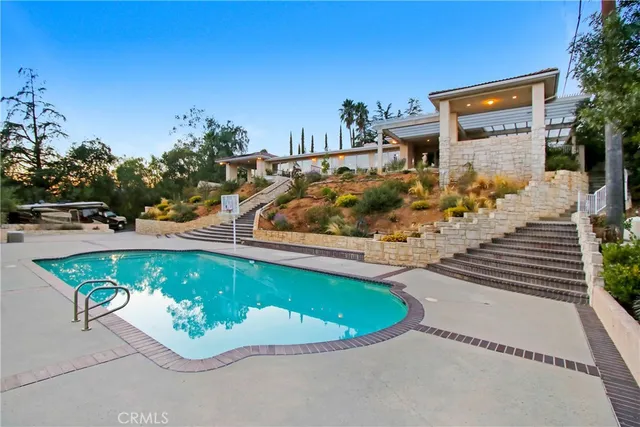 an aerial view of a house with a garden