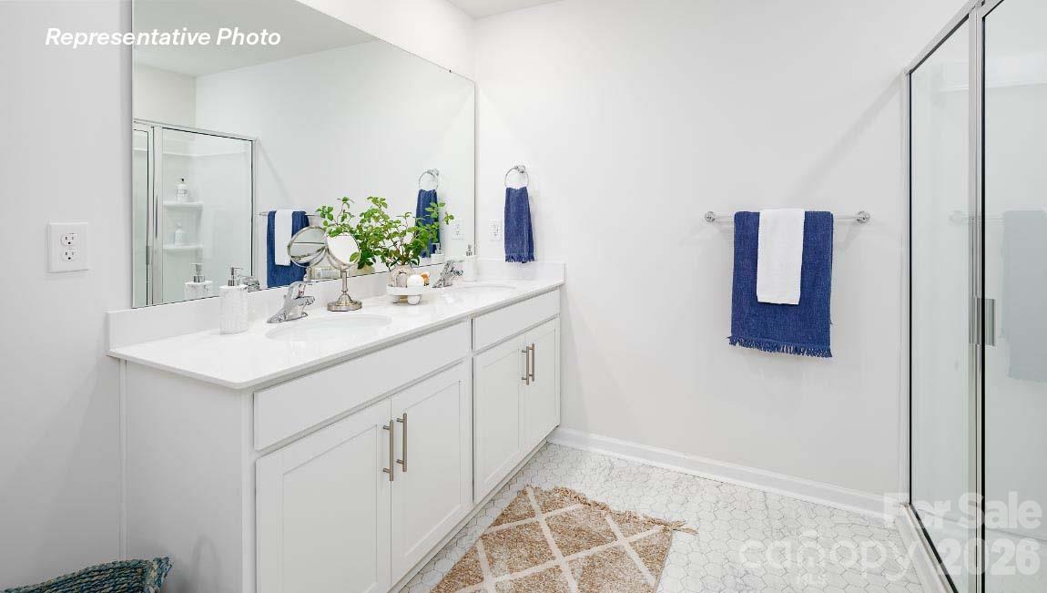 4552 Harris Elliot Road Lincolnton, NC 28092 - Photo 17 of 31 a bathroom with a sink and a mirror