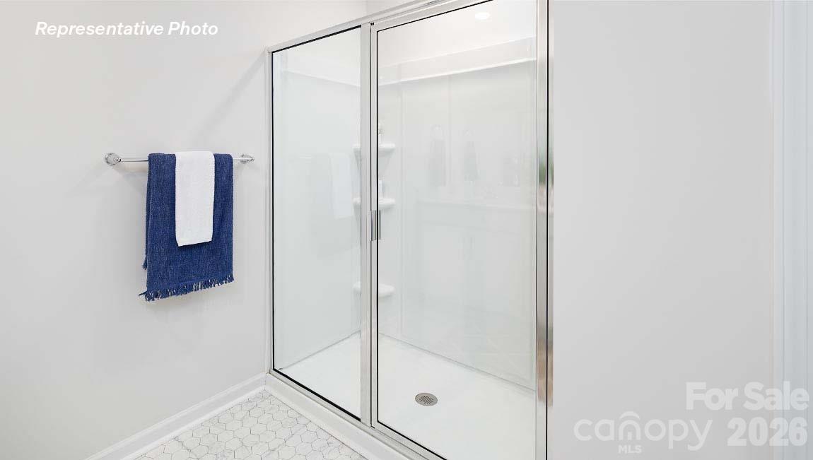 4552 Harris Elliot Road Lincolnton, NC 28092 - Photo 19 of 31 a bathroom with a glass shower door