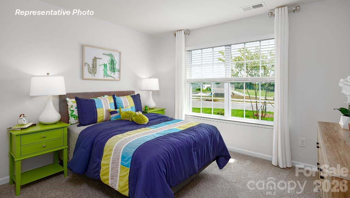 4552 Harris Elliot Road Lincolnton, NC 28092 - Photo 20 of 31 a bedroom with a bed and a window