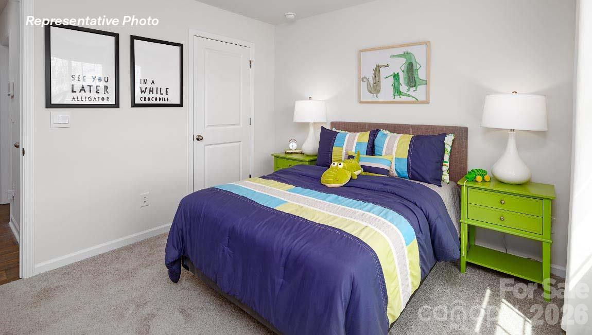 4552 Harris Elliot Road Lincolnton, NC 28092 - Photo 21 of 31 a bedroom with a bed and painting on the wall