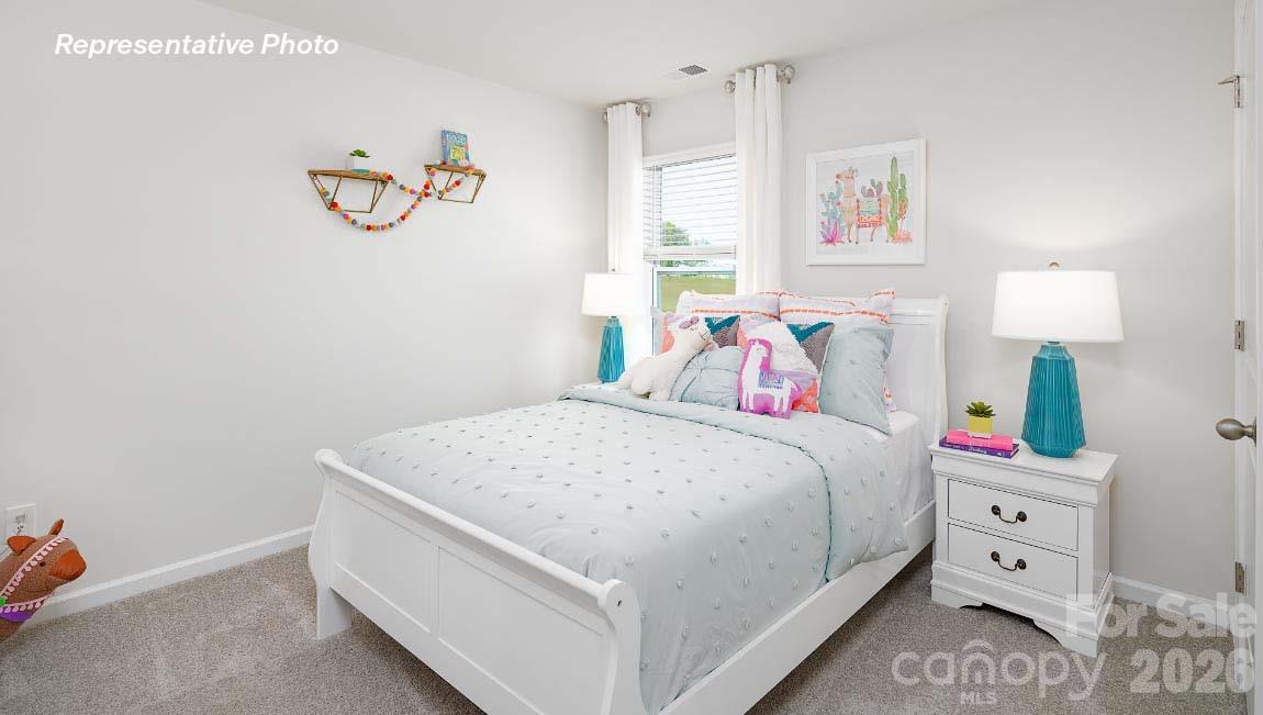 4552 Harris Elliot Road Lincolnton, NC 28092 - Photo 23 of 31 a bedroom with a bed and a window