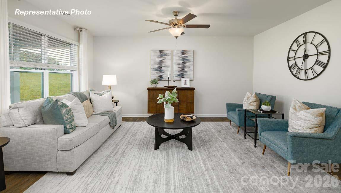 4552 Harris Elliot Road Lincolnton, NC 28092 - Photo 10 of 31 a living room with furniture a table and a large window