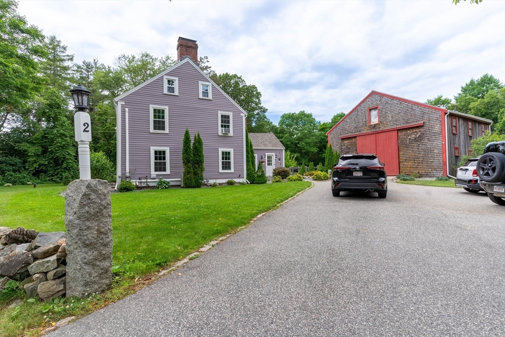 2 Kelsey Road Boxford, MA 01921 - Photo 2 of 42 a car parked in front of a house with a yard
