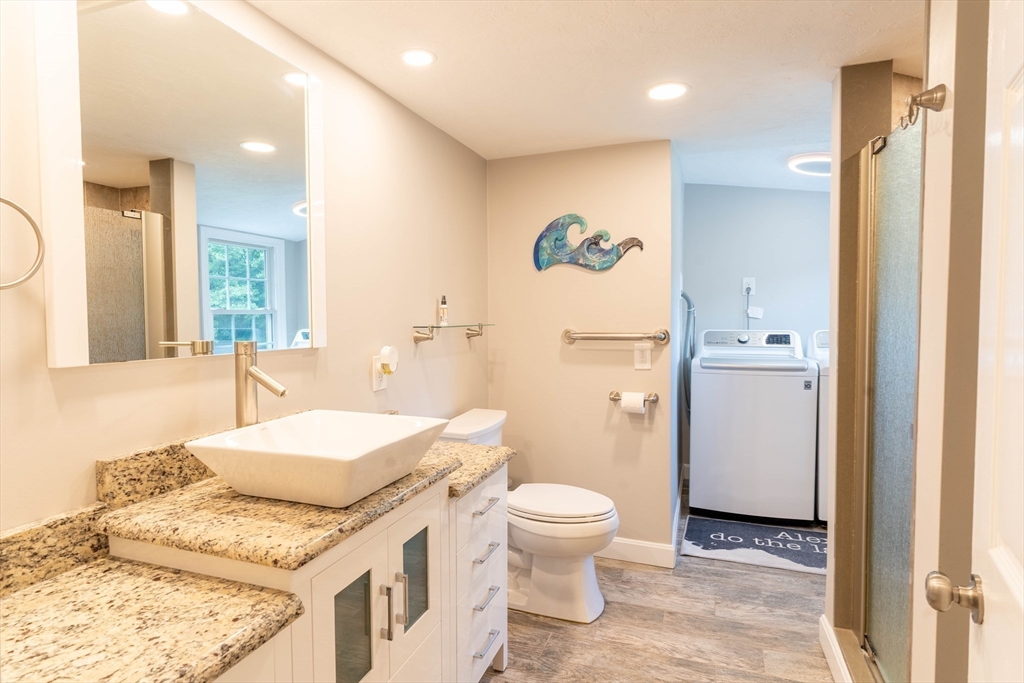 2 Kelsey Road Boxford, MA 01921 - Photo 21 of 42 a bathroom with a granite countertop sink mirror vanity and toilet