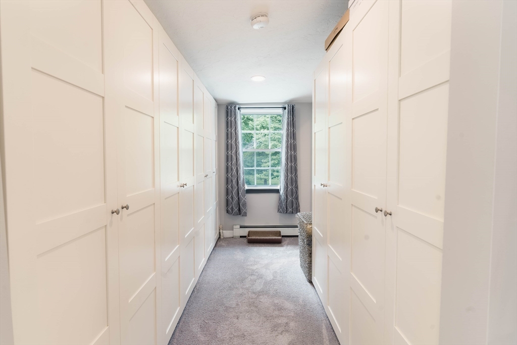 2 Kelsey Road Boxford, MA 01921 - Photo 23 of 42 a view of a hallway with a window