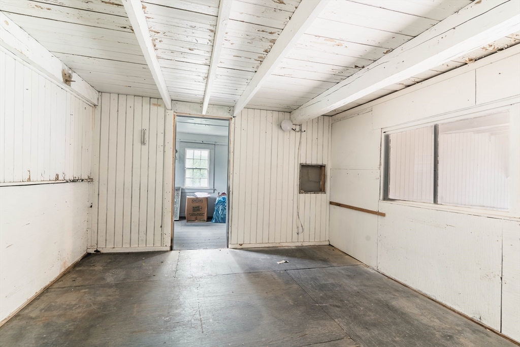 2 Kelsey Road Boxford, MA 01921 - Photo 30 of 42 a view of a hallway with wooden walls