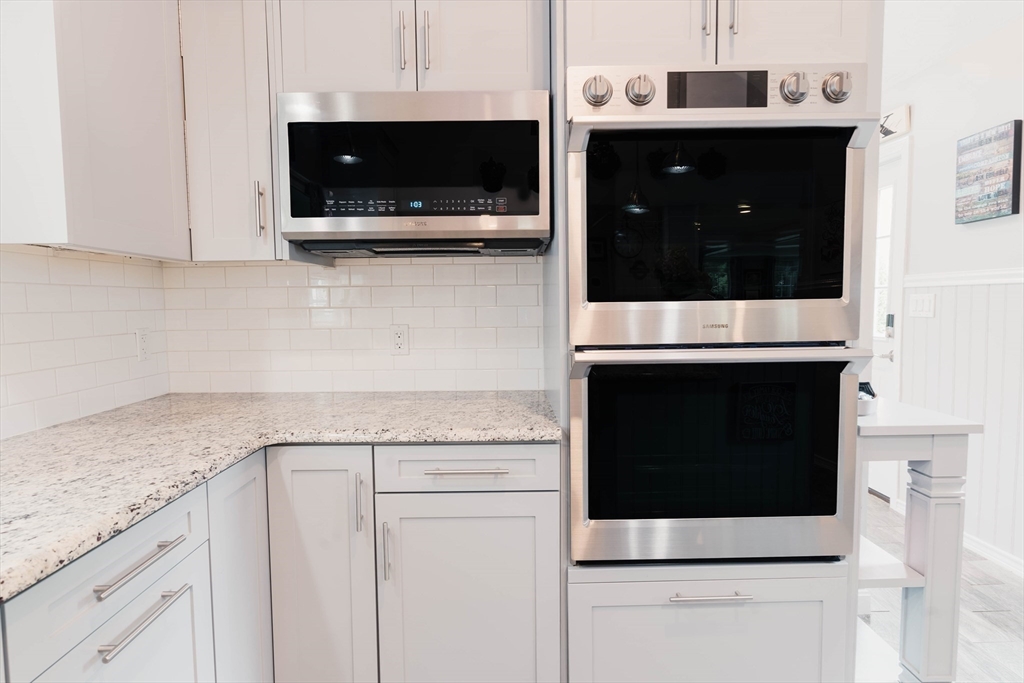 2 Kelsey Road Boxford, MA 01921 - Photo 7 of 42 a kitchen with stainless steel appliances granite countertop white cabinets and a sink