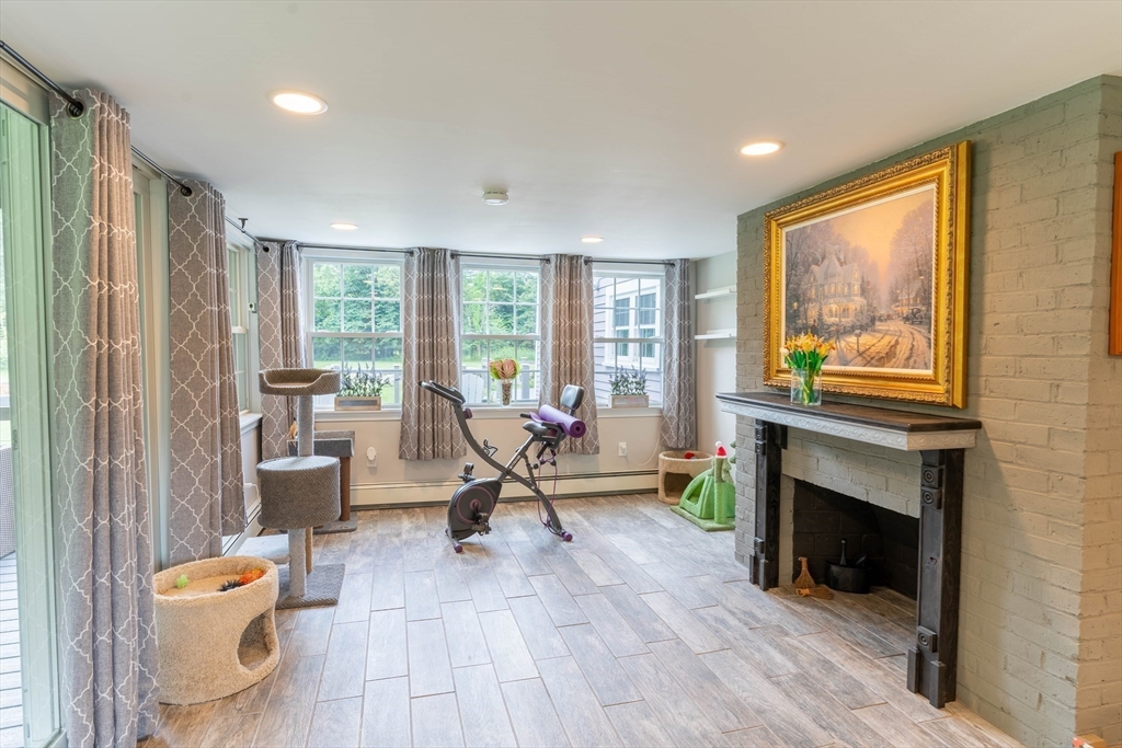 2 Kelsey Road Boxford, MA 01921 - Photo 9 of 42 a living room with furniture and a fireplace