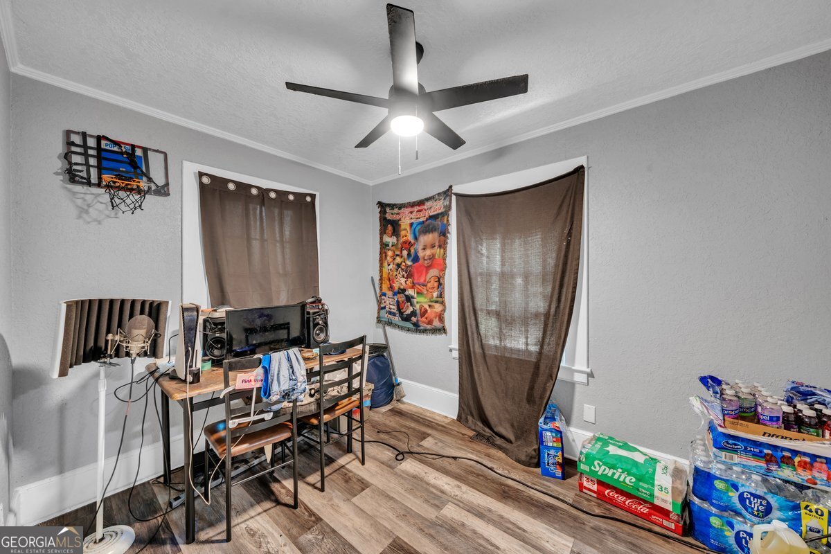 415 East 7th Avenue Cordele, GA 31015 - Photo 6 of 13 a workspace with furniture hardwood and a window