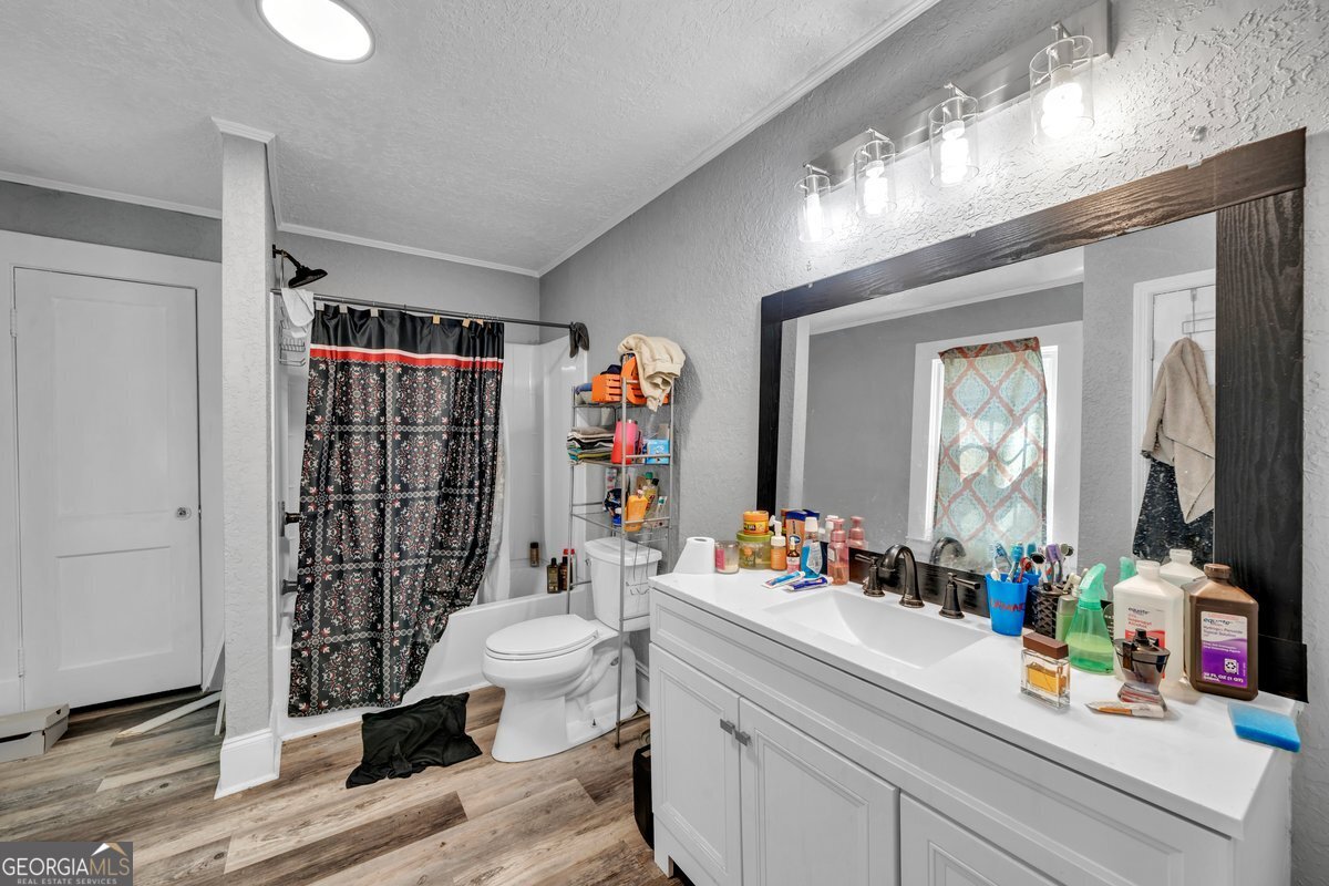 415 East 7th Avenue Cordele, GA 31015 - Photo 10 of 13 a bathroom with a sink toilet and shower