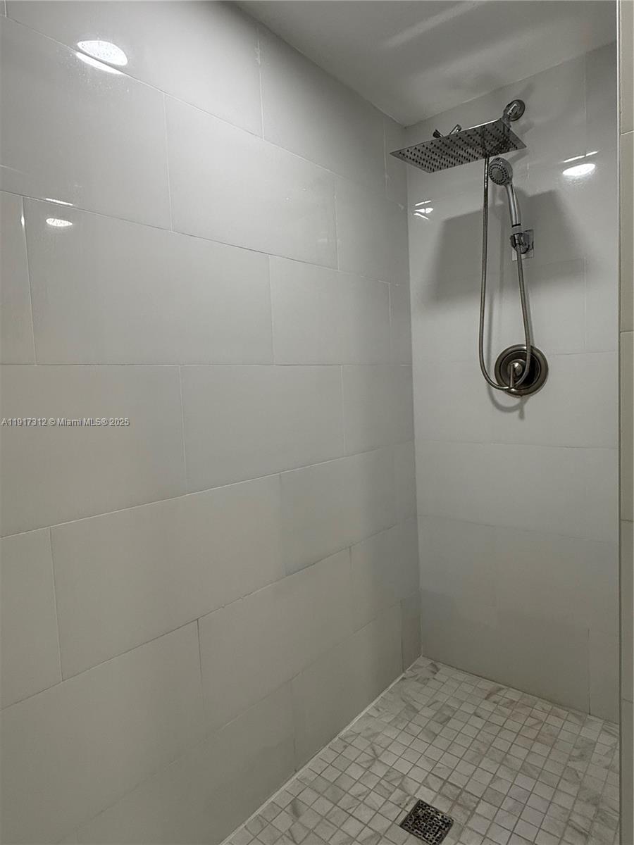 4850 Southwest 63rd Terrace, Unit 312 Davie, FL 33314 - Photo 15 of 27 a bathroom with a shower