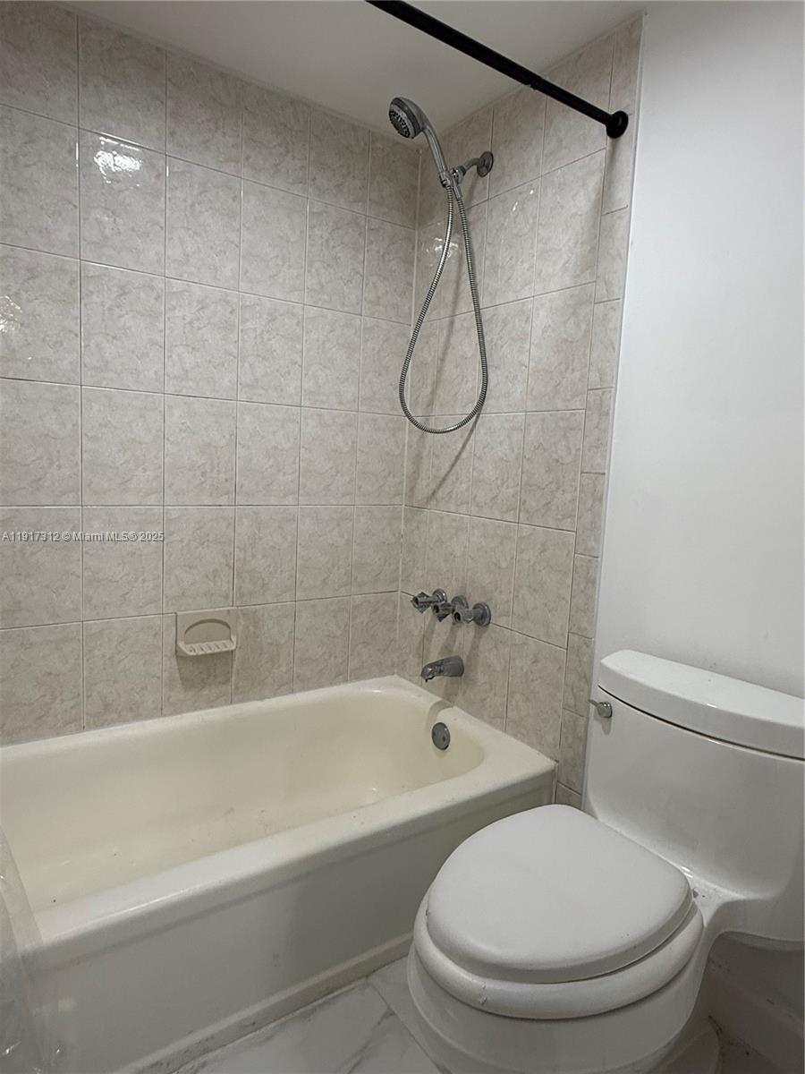 4850 Southwest 63rd Terrace, Unit 312 Davie, FL 33314 - Photo 22 of 27 a bathroom with a toilet and a bathtub