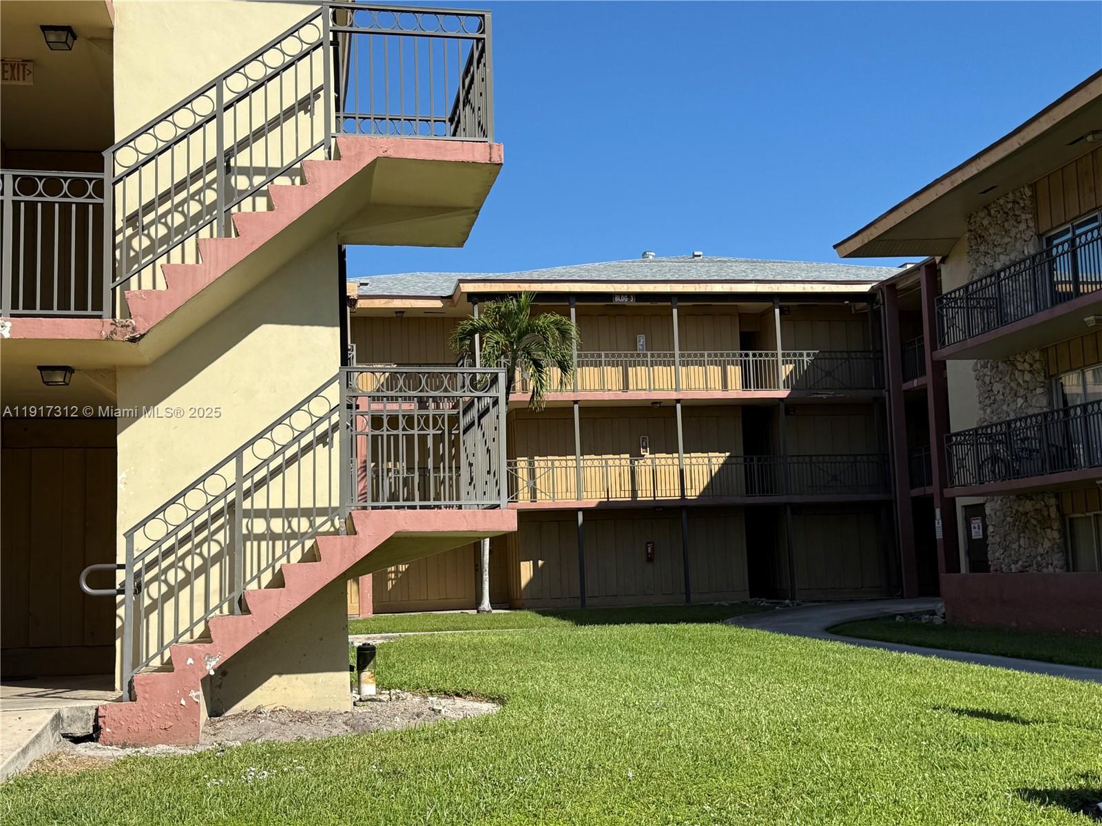 4850 Southwest 63rd Terrace, Unit 312 Davie, FL 33314 - Photo 26 of 27 a view of front door of house with outdoor space