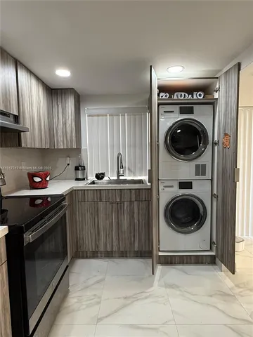 a kitchen with a stove and a refrigerator