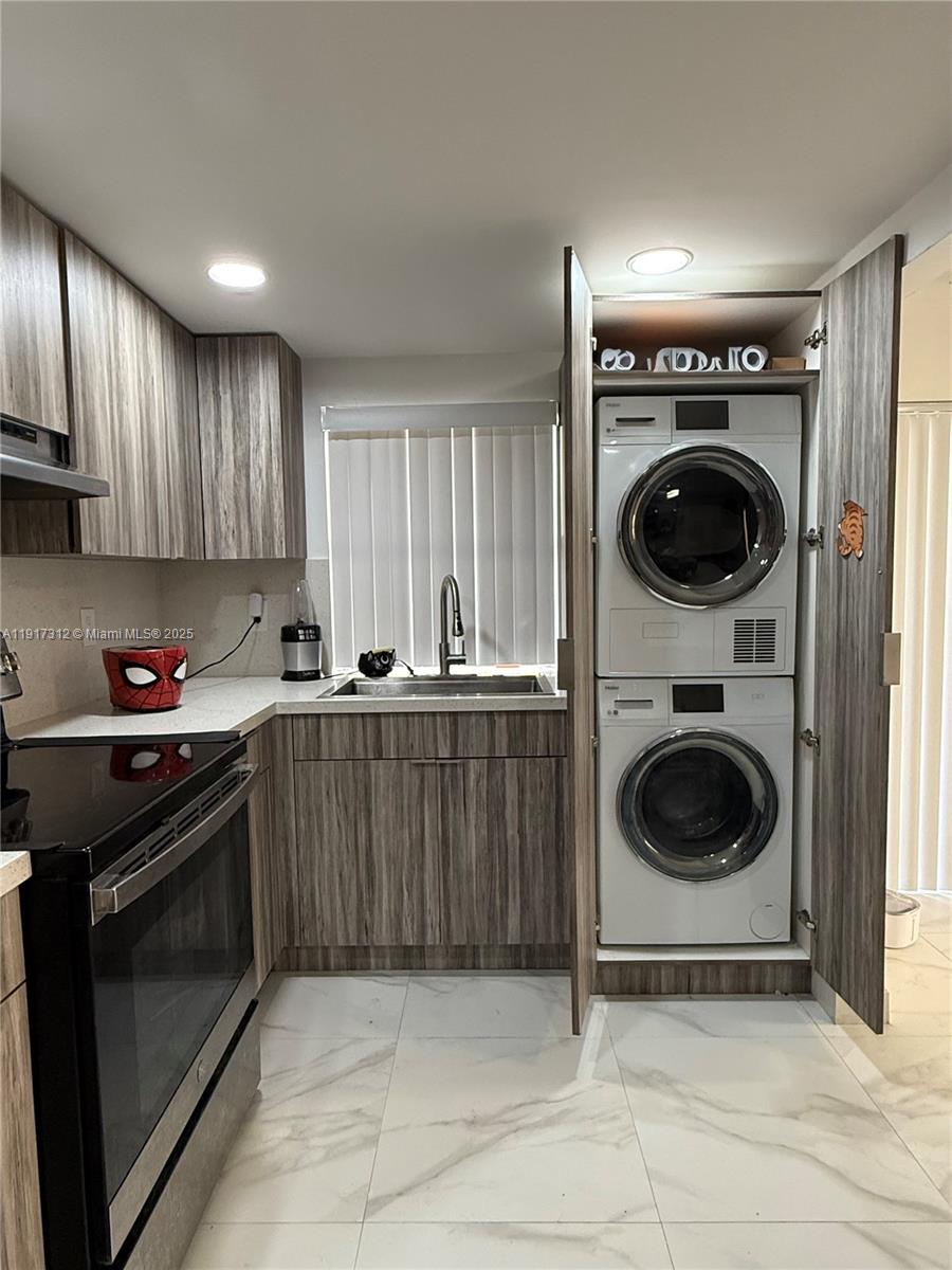 4850 Southwest 63rd Terrace, Unit 312 Davie, FL 33314 - Photo 7 of 27 a kitchen with a stove and a refrigerator