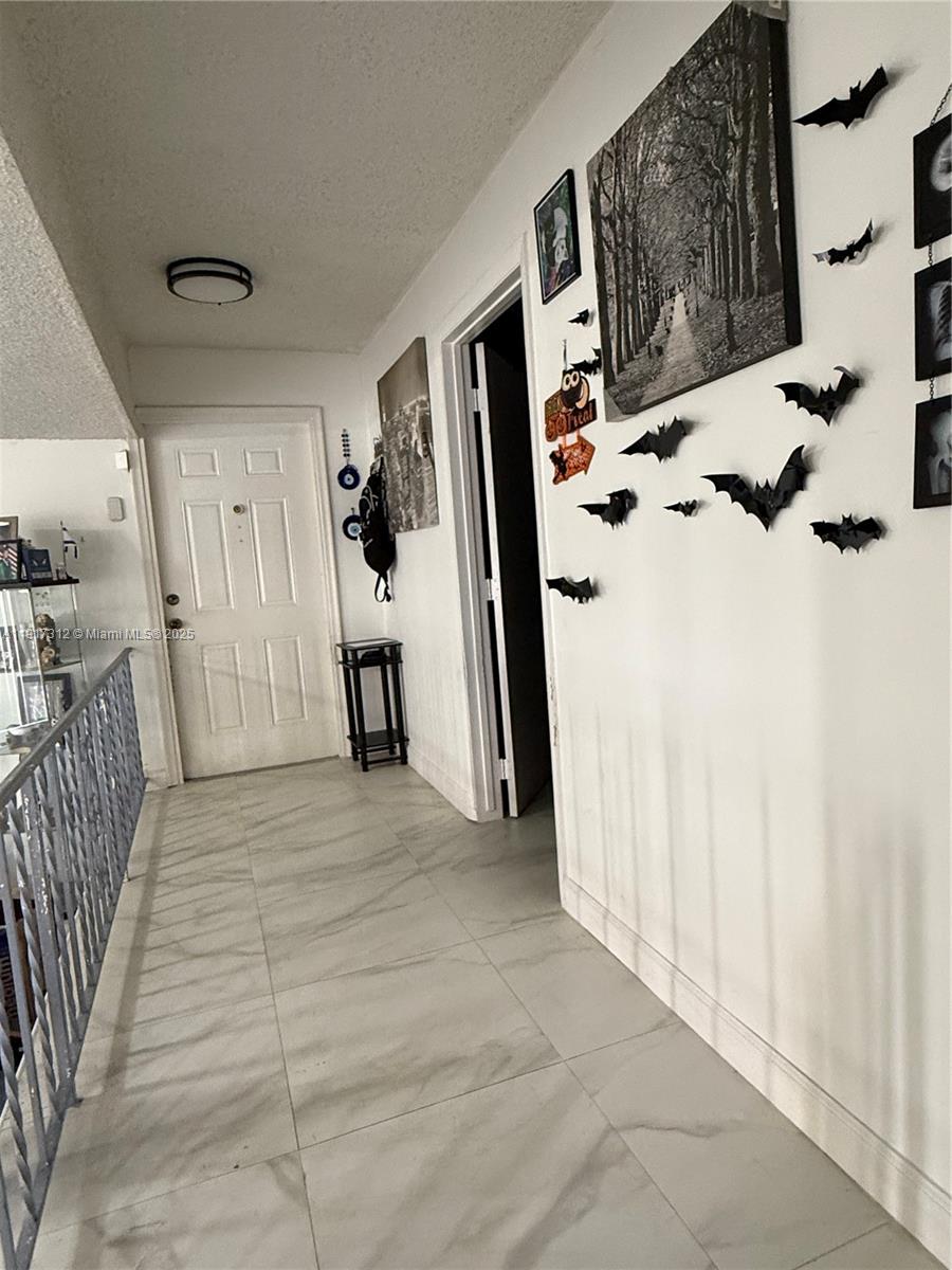 4850 Southwest 63rd Terrace, Unit 312 Davie, FL 33314 - Photo 9 of 27 a view of entryway with window and stairs