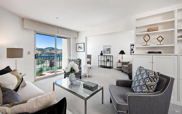 a living room with furniture and a large window