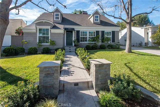 a front view of a house with garden