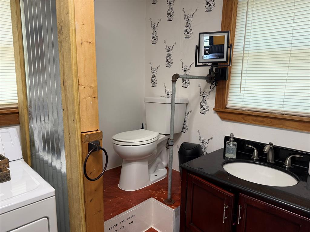 111 Apache Trail Whitney, TX 76692 - Photo 23 of 40 a bathroom with a granite countertop sink toilet and mirror