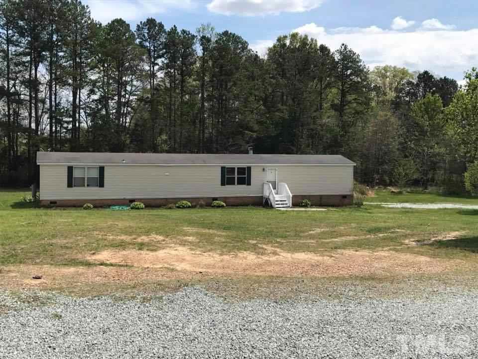 1750 Antioch Church Road Timberlake, NC 27583 - Photo 1 of 10 a view of a house with a yard
