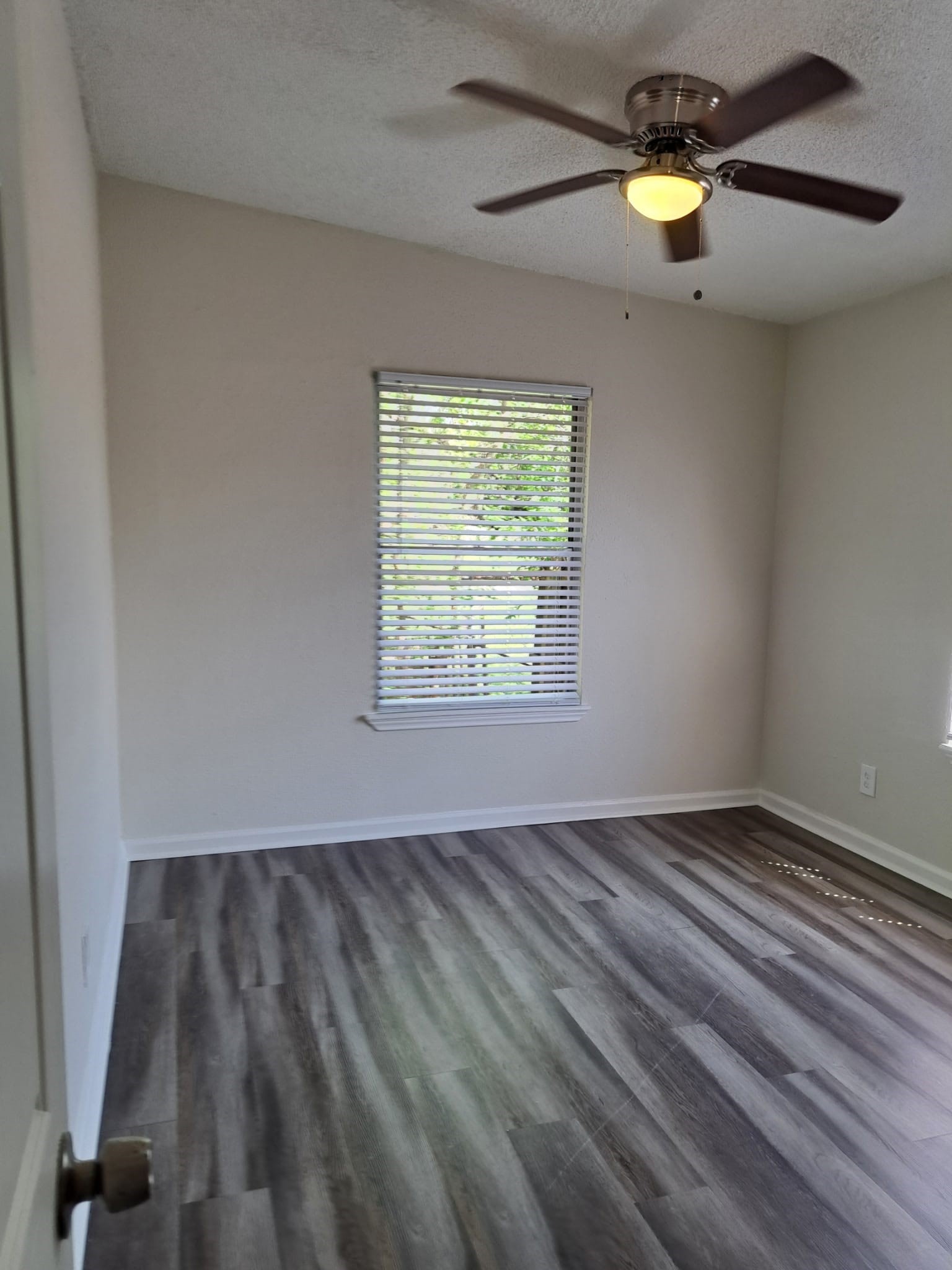 3357 Frick Road, Unit 2 Houston, TX 77086 - Photo 6 of 9 Bedroom 2 with ceiling fan and no carpet