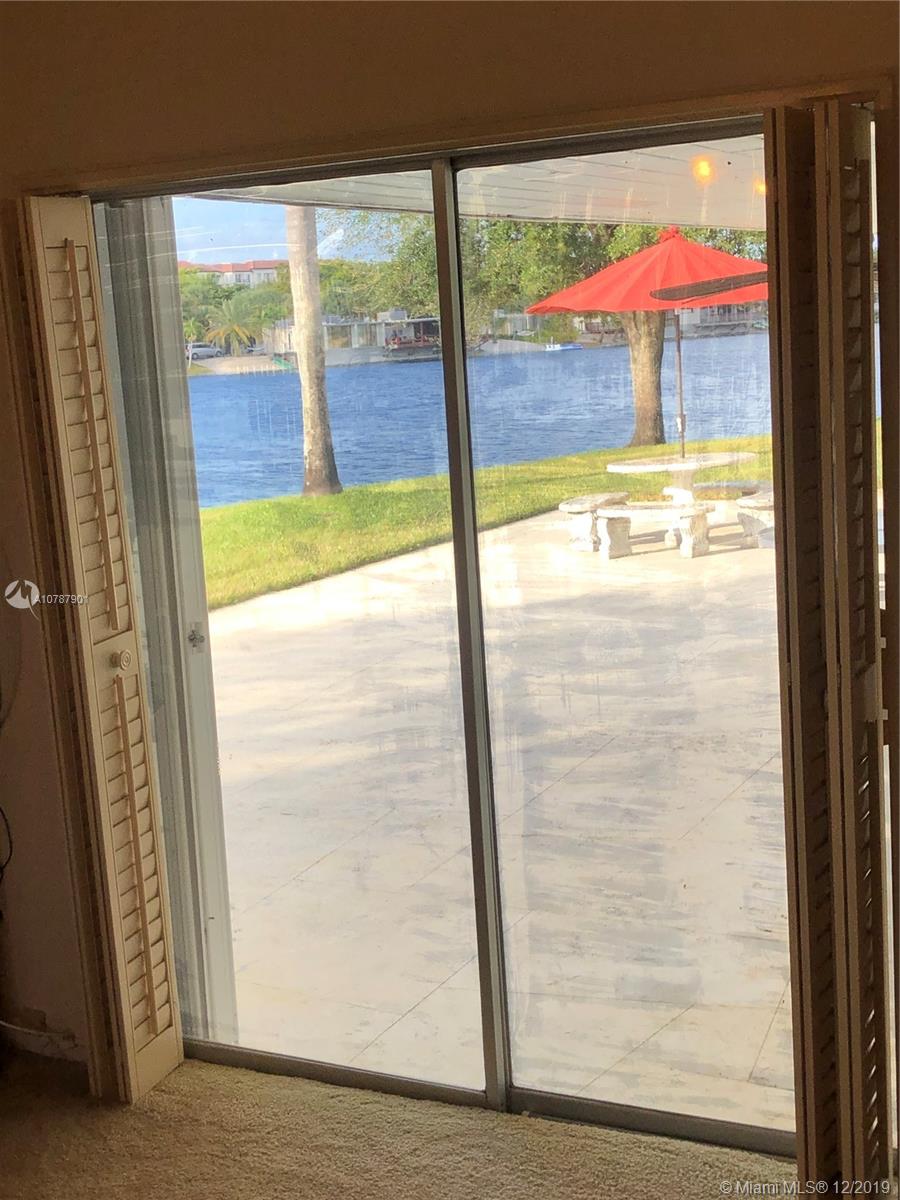 14640 Fitzpatrick Road Miami Lakes, FL 33014 - Photo 25 of 77 LAKE VIEW FROM MASTER BEDROOM SLIDING GLASS DOORS.