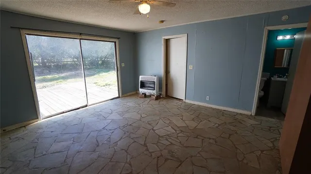 a bathroom with a sink mirror and a window