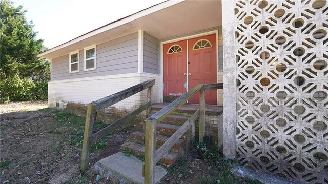 a front view of a house with stairs
