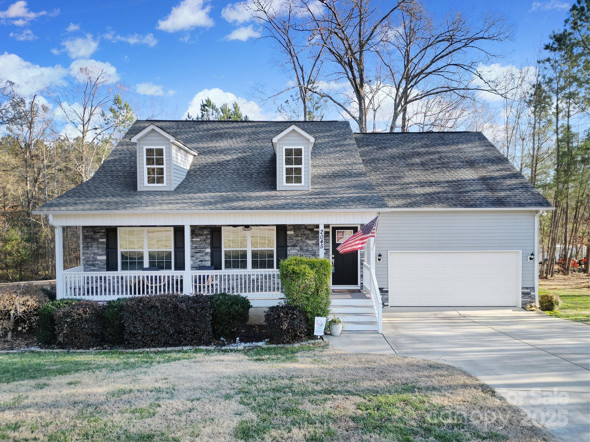 2045 Roadrunner Road Clover, SC 29710 - Photo 1 of 38 a front view of a house with garden