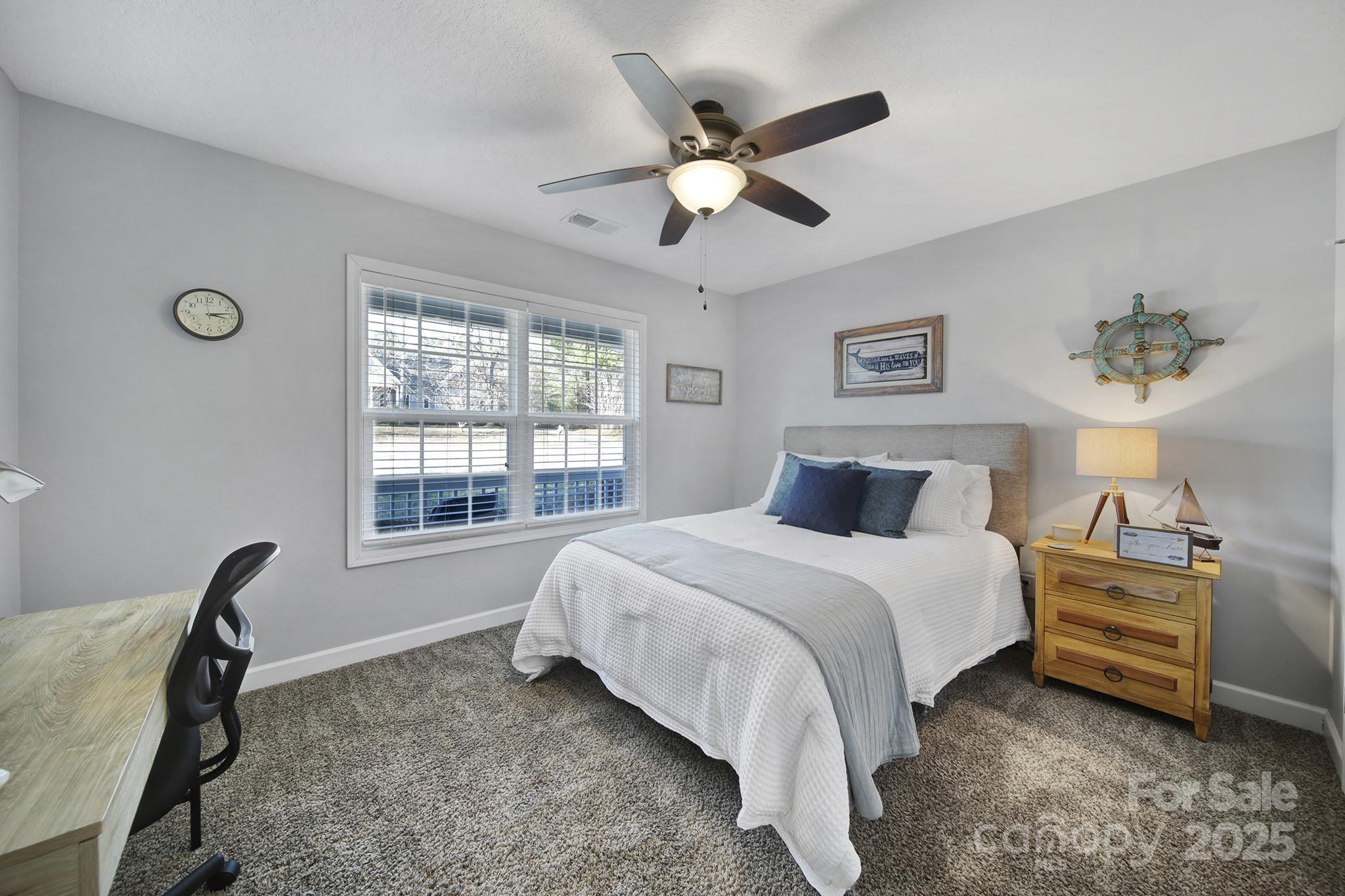 2045 Roadrunner Road Clover, SC 29710 - Photo 20 of 38 a spacious bedroom with a bed and a window