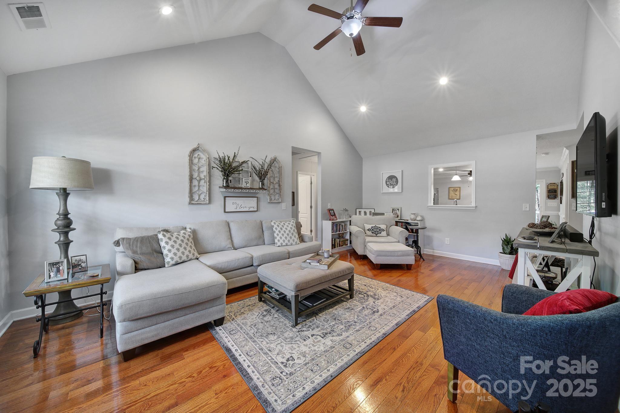 2045 Roadrunner Road Clover, SC 29710 - Photo 2 of 38 a living room with furniture and a flat screen tv